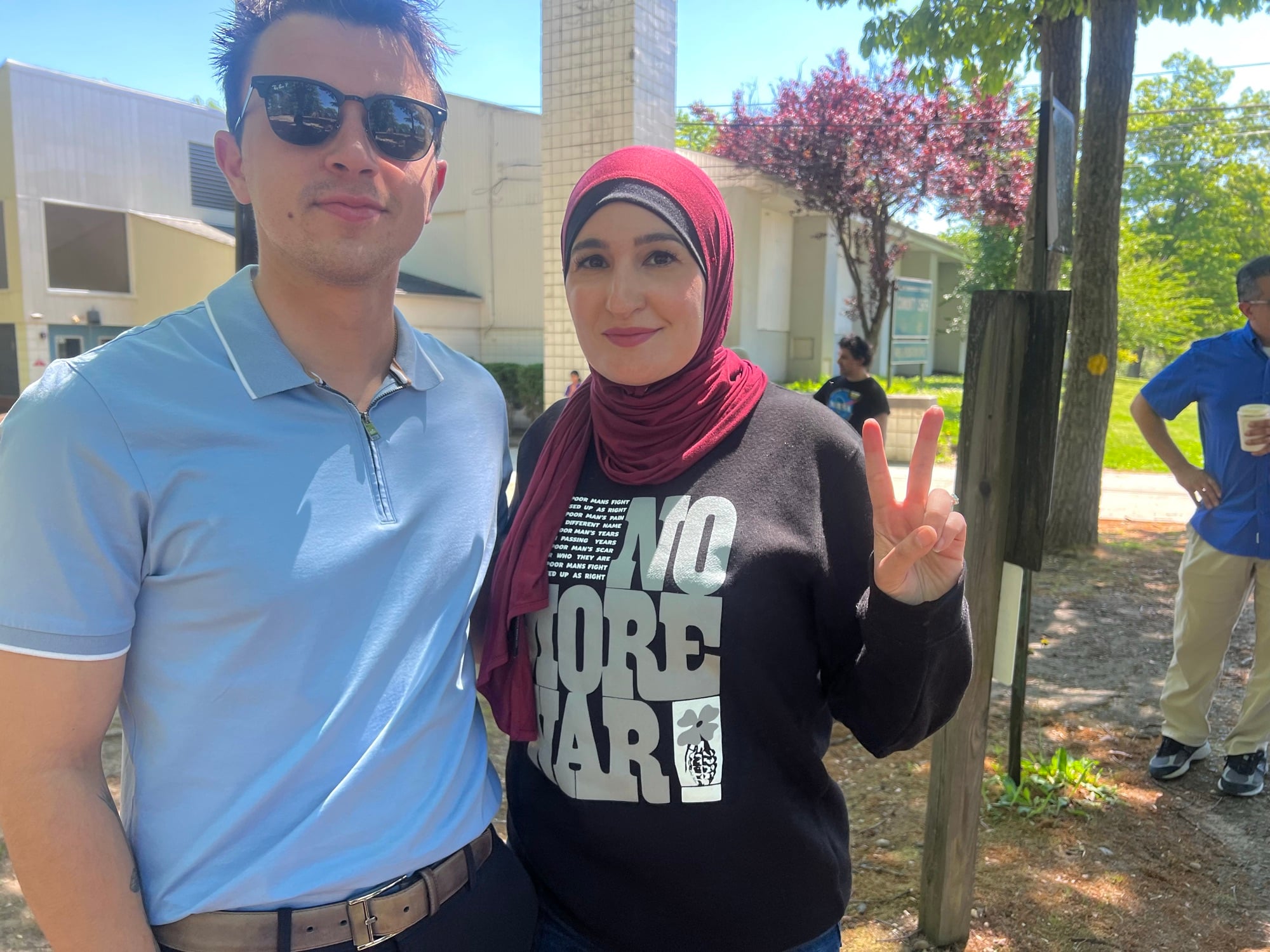 Adam Rueda standing with a constituent advocating for peace and human rights in NJ-5